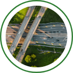 A large freeway and overpass with moderate traffic.
